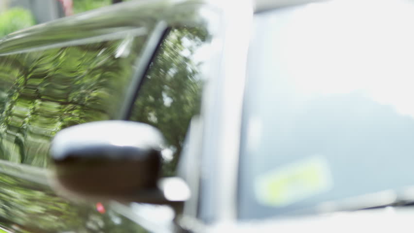 Limousine driver airport meet and greet service meeting ethnic male female company executives arriving back from business travel lifestyle