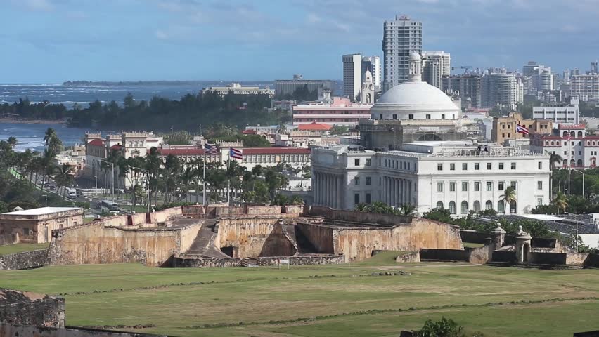 view of downtown old san juan puerto rico from spanish fort (historic buildings and caribbean sea) famous travel destination tropical getaway