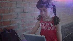 Animation of network of connections over caucasian schoolgirl using tablet. Global education, learning, connections and digital interface concept digitally generated video. - Powered by Shutterstock - Get 15% off with code: PIKWIZARD15