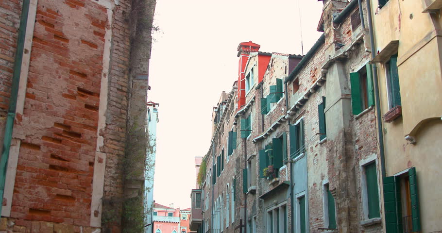 Exploring the charming streets of Venice with historic architecture and vibrant colors in the afternoon hours