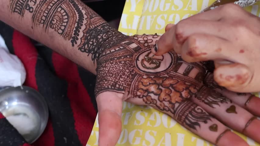 Bangalore, India 7th September 2024: Indian Groom wedding henna mehendi mehndi feet close up. Henna pattern. Traditional Rasam or rivaz of done with henna mehandi. Practiced in India and Pakistan