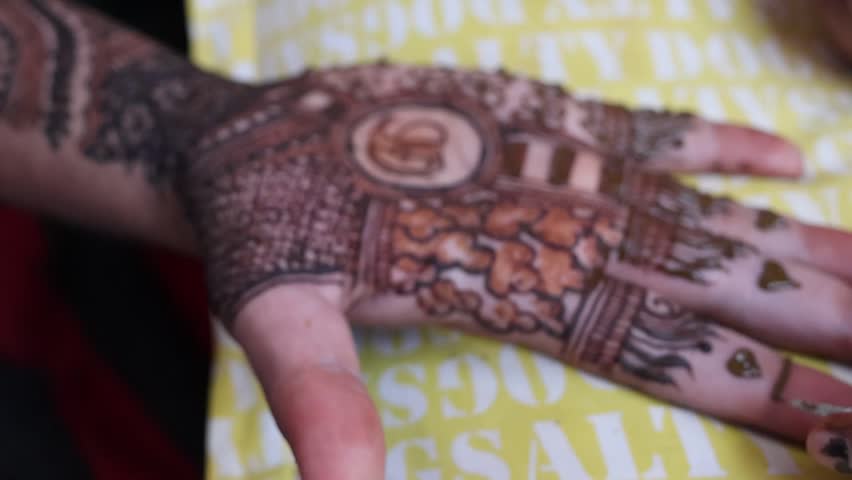 Bangalore, India 7th September 2024: Indian Groom wedding henna mehendi mehndi feet close up. Henna pattern. Traditional Rasam or rivaz of done with henna mehandi. Practiced in India and Pakistan