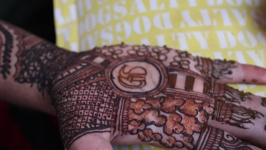 Bangalore, India 7th September 2024: Indian Groom wedding henna mehendi mehndi feet close up. Henna pattern. Traditional Rasam or rivaz of done with henna mehandi. Practiced in India and Pakistan