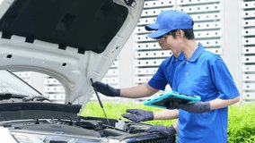 Worker checking the engine compartment of a car - Powered by Shutterstock - Get 15% off with code: PIKWIZARD15