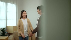 Young happy couple dancing with holding hands and smiling to each other after moving to new house, family lifestyle in new real estate, relocating new apartment concept.
 - Powered by Shutterstock - Get 15% off with code: PIKWIZARD15