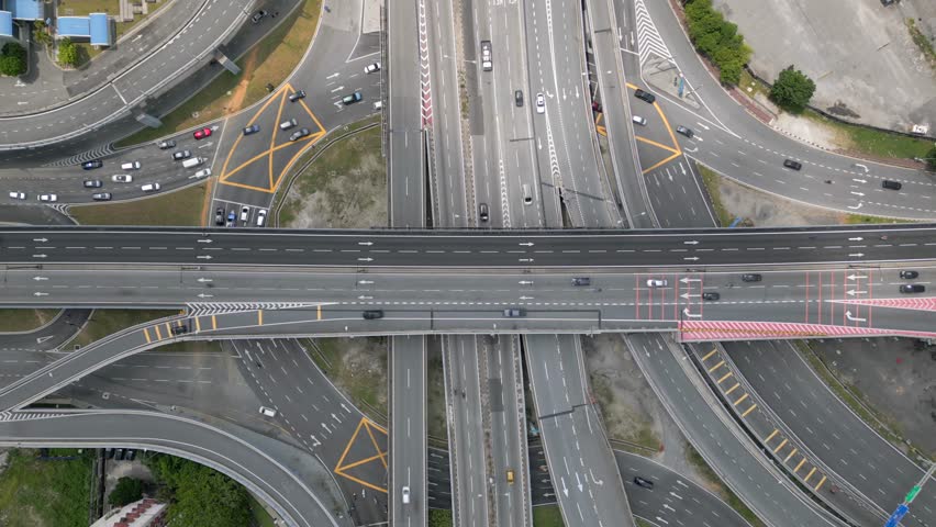 Aerial view of morning traffic on multi-lane road in downtown Kuala Lumpur, Malaysia.