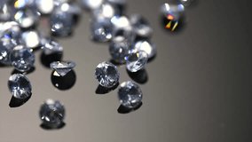 Diamonds rotating on black background, crystals, beautiful shining brilliants sparkling with colorful caustics, rainbow lights. Moissanite. Zirconia. Diamonds sparkle and shimmer on black.  - Powered by Shutterstock - Get 15% off with code: PIKWIZARD15