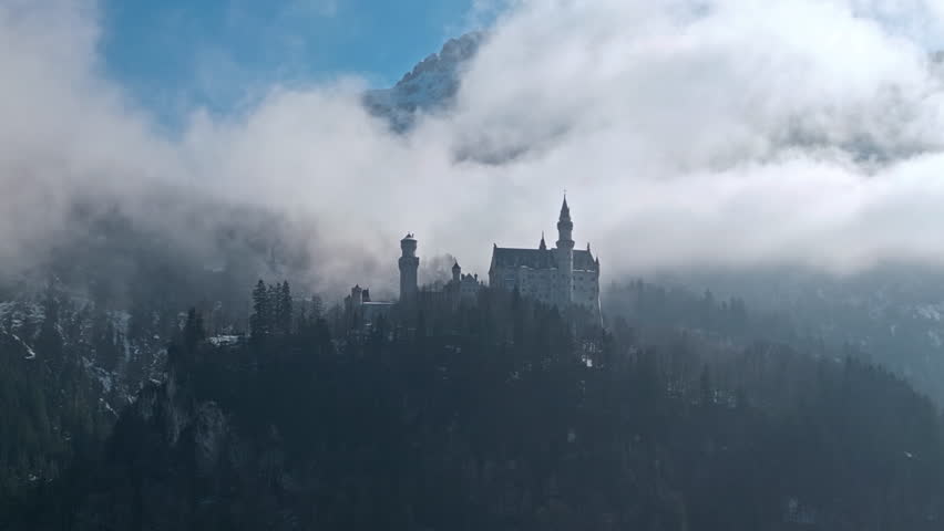 aerial view of Neuschwanstein Castle Germany. Winter season, beautiful historical architecture of the building surrounded by mountains. High quality 4k footage