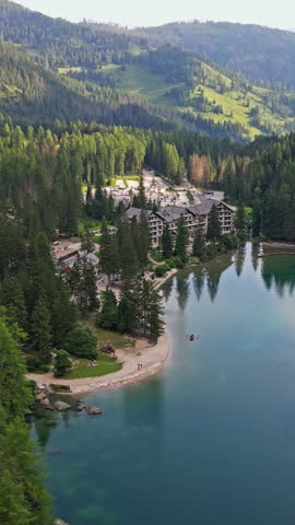 Scenic Drone Footage of Lago di Braies, Italy - Beautiful Mountain Lake in the Dolomite Alps. High quality 4k footage