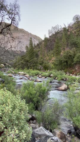 SLOW MOTION SHOT - The Merced River threads through Yosemite National Park in a stretch popular for boating and whitewater rafting, in El Portal, California, USA.