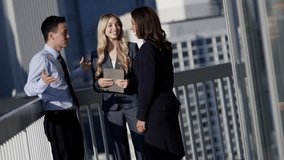 Handshake of multi ethnic male and female business team using tablet technology outdoors Corporate Lifestyle - Powered by Shutterstock - Get 15% off with code: PIKWIZARD15