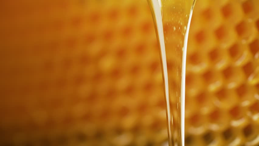 Honey Pouring Honeycombs Backdrop. Golden Nectar Dripping.sweet Drops Macro View