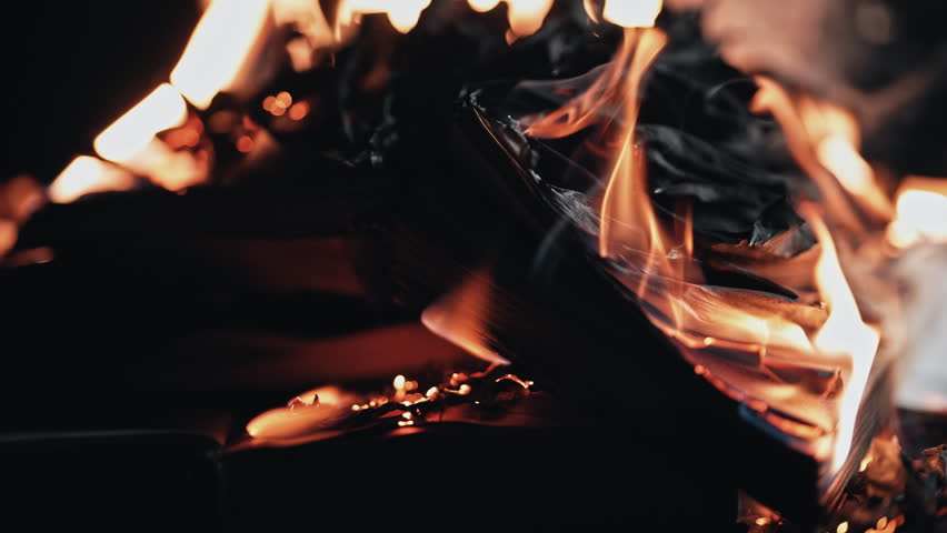 Open Books On Fire, Pages Are Engulfed In Flames. Concept Of Censorship , Ash