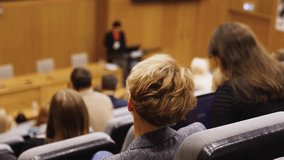 College students class with the professor in the auditorium, audience at the conference hall listens to lecturer, lecture seminar together listen to teacher, university classroom with faculty member
 - Powered by Shutterstock - Get 15% off with code: PIKWIZARD15