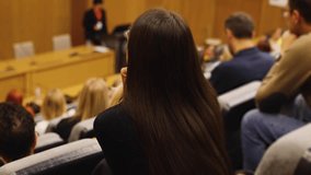 College students class with the professor in the auditorium, audience at the conference hall listens to lecturer, lecture seminar together listen to teacher, university classroom with faculty member
 - Powered by Shutterstock - Get 15% off with code: PIKWIZARD15