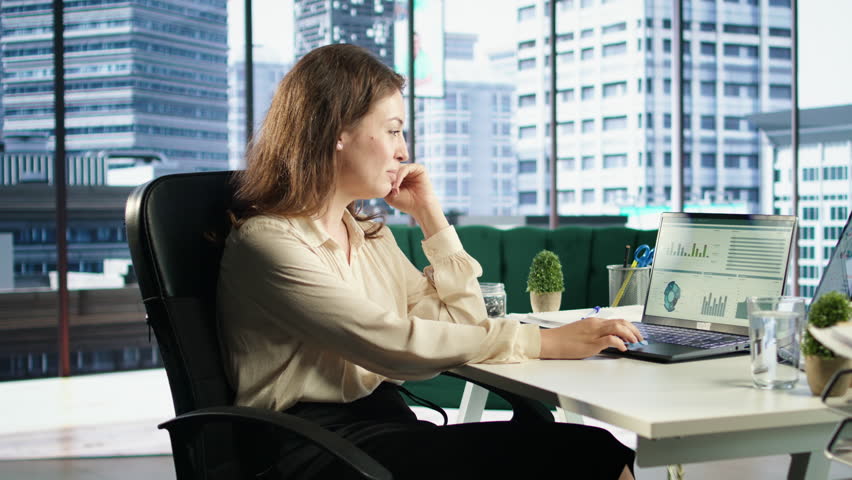 Ambitious female leader developing a strategic plan for business growth, aligning the company efforts with the enterprise vision and market opportunities for global expansion. Camera A.