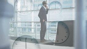 Businessman talking on phone with multiple clocks animation over office background. communication, technology, global, corporate, international, time - Powered by Shutterstock - Get 15% off with code: PIKWIZARD15