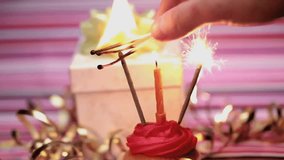 Cupcake with candles and sparklers surrounded by confetti animation, celebrating birthday. celebration, party, festive - Powered by Shutterstock - Get 15% off with code: PIKWIZARD15