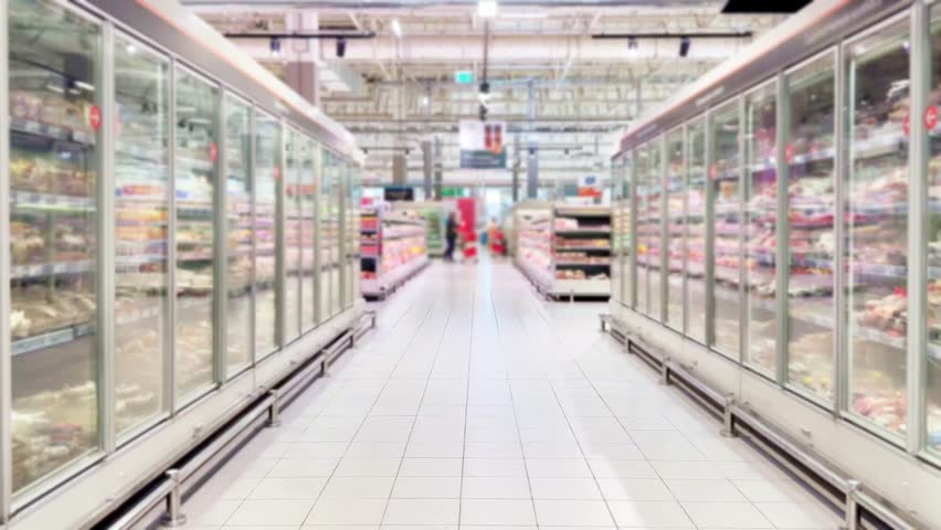 choosing a dairy products at supermarket	.oil,  ham, sauce, olives at the grocery store