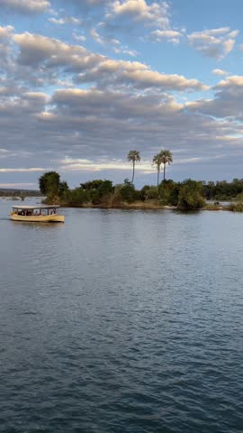 Cruise on the Zambezi River, between Zambia and Zimbabwe. At sunset, we