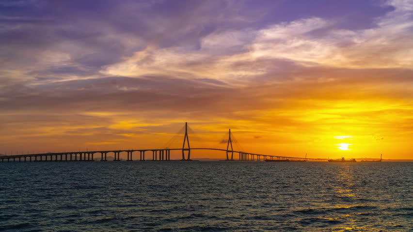 TimeLapse 4k Sunset and night view of Incheon Bridge on the sea against sea horizon in summer South Korea