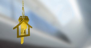 Golden house keychain animation over blurred background. Real estate, property, home, investment, purchase, luxury - Powered by Shutterstock - Get 15% off with code: PIKWIZARD15