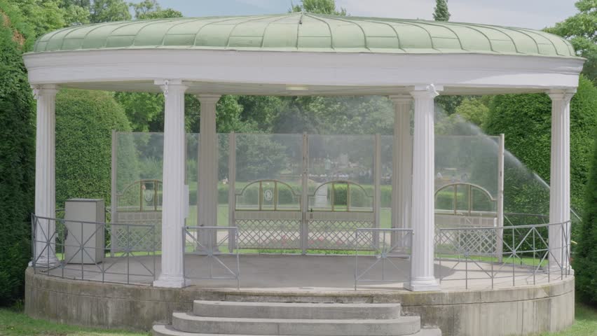 Historical Gazebo Surrounded by Lush Greenery and Trees in Stadtpark, Vienna - Austria.