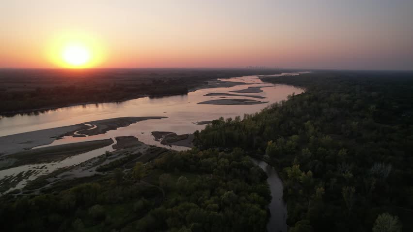 The main river of Poland flowing through the capital Warsaw with a record low water level (September 2024), drying up, no water, close-up, sunset