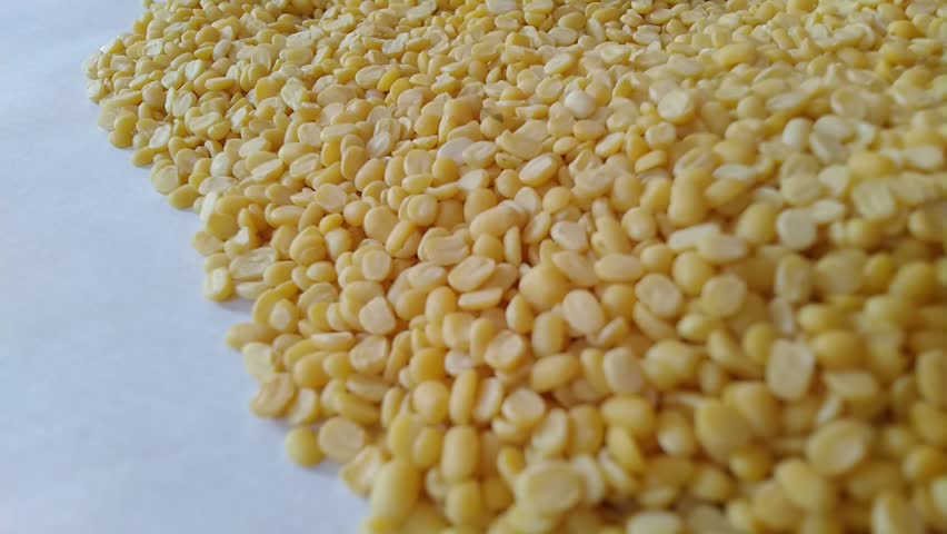 Close up shot of Moong Dal or yellow petite lentils