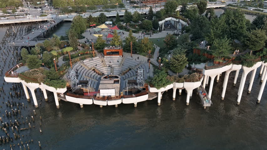 A drone aerial view of Little Island, an innovative park built on stilts over the Hudson River.