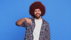 Look at advertisement. Caucasian man pointing down, saying to subscribe, gesturing ok and like, showing place for commercial, promotional information below. Stylish guy isolated on blue background - Powered by Shutterstock - Get 15% off with code: PIKWIZARD15