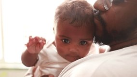 Father, crying baby and comfort, kiss and care, love and bonding in family home together. Dad, sad infant and parent support newborn, holding frustrated young kid and calm child, stress and console - Powered by Shutterstock - Get 15% off with code: PIKWIZARD15