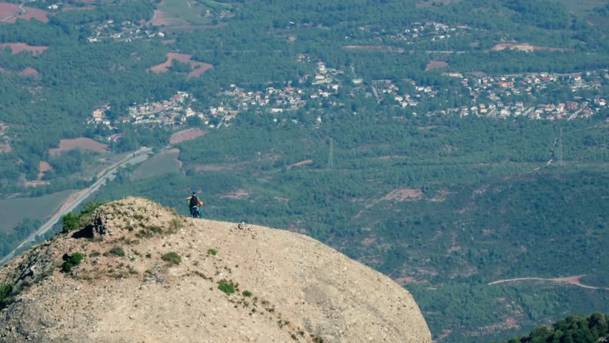 Person standing on large rock