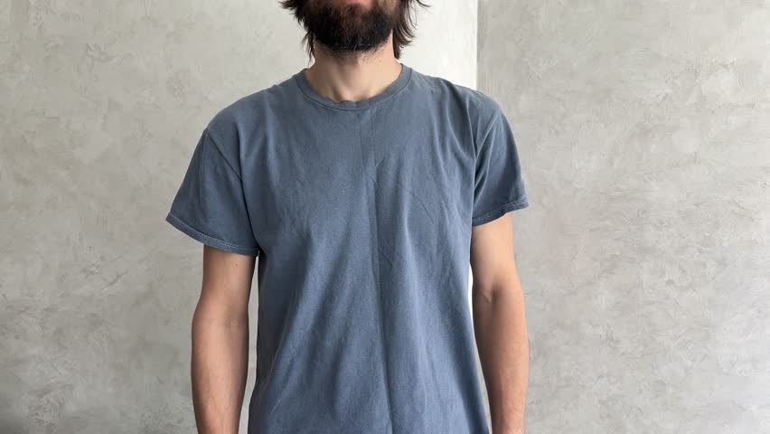 Man performs a series of hand and wrist stretches against a neutral gray background, promoting flexibility and mobility