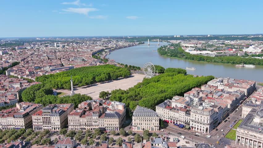 Bordeaux, France: Aerial view of famous French historic city, famous square Place des Quinconces with Monument aux Girondins, summer day with blue sky - landscape panorama of Europe from above