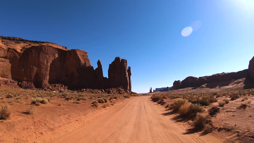 POV Monument Valley dirt road Wild West Landscape Tribal Park Colorado Plateau Utah Arizona border USA travel