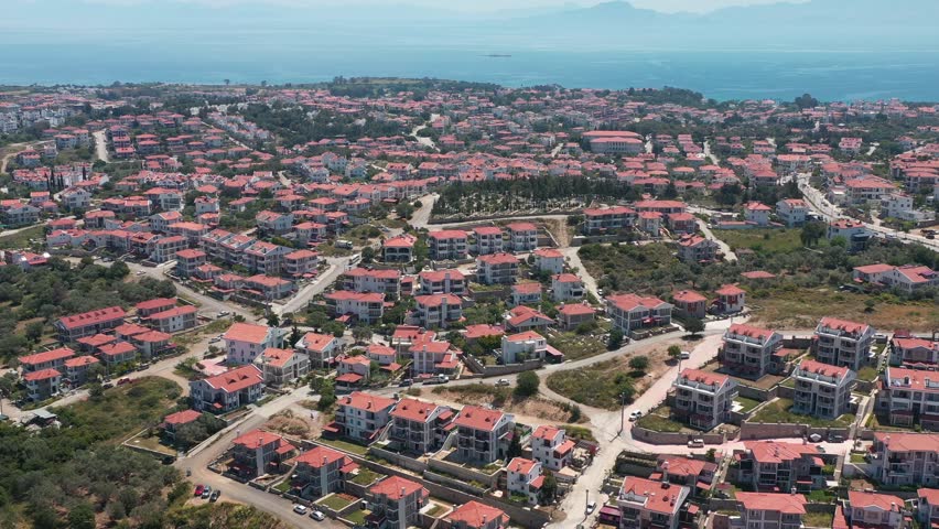 Datcha city from above. Aerial view of Turkish city with cosy similar houses