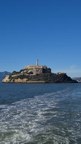 Vertical View, Sailing Away From Alcatraz Prison Island on Sunny Day, San Francisco Bay, California USA