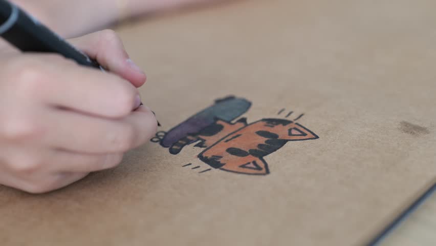 An 11-year-old girl creates charming animal illustrations at home, showcasing her artistic talent and creativity during her free time