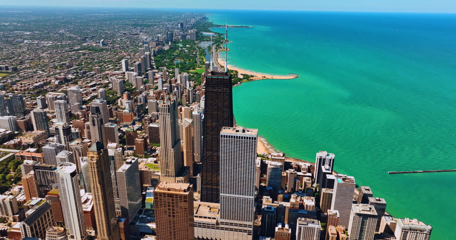 Picturesque shore of Lake Michigan in Chicago, Illinois, the USA. Aerial perspective on the downtown of metropolis with beautiful architecture and Lakeshore Drive.