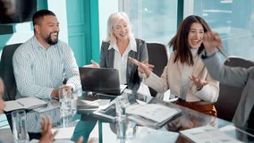 Clapping, high five and business people in office for meeting with deal, partnership or agreement. Applause, diversity and group of professional creative designers celebrating for goal in workplace - Powered by Shutterstock - Get 15% off with code: PIKWIZARD15