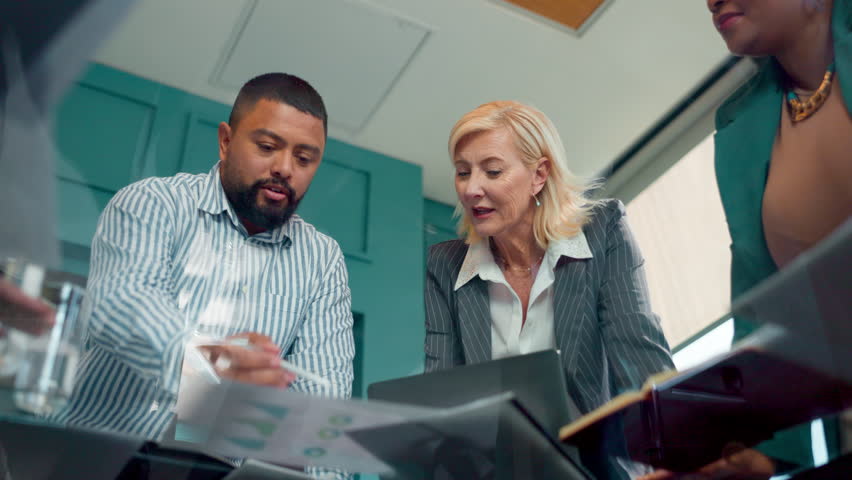 Discussion, group and meeting in boardroom, ideas and documents for financial report or brainstorming. Low angle, talk and ai for fraud detection of insurance and processing of claims, plan or people