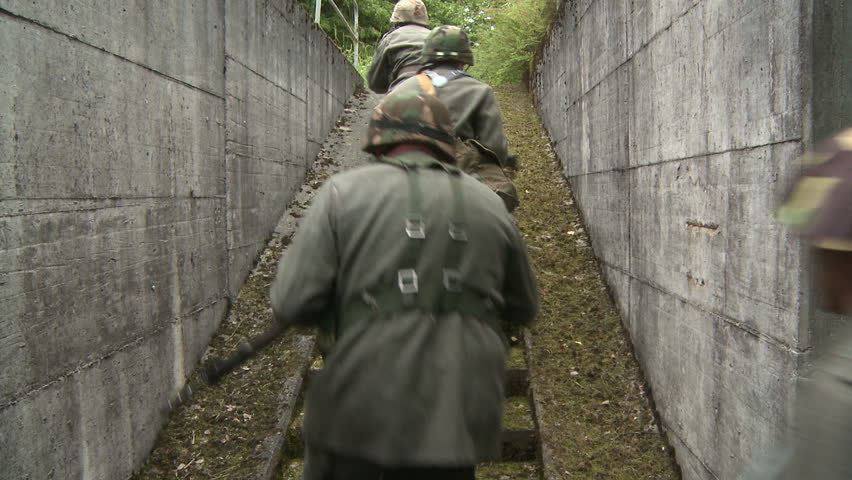 Soldiers running up stairs