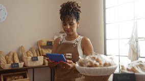 Young woman in bakery shop using tablet surrounded by bread baskets and gluten-free signs - Powered by Shutterstock - Get 15% off with code: PIKWIZARD15