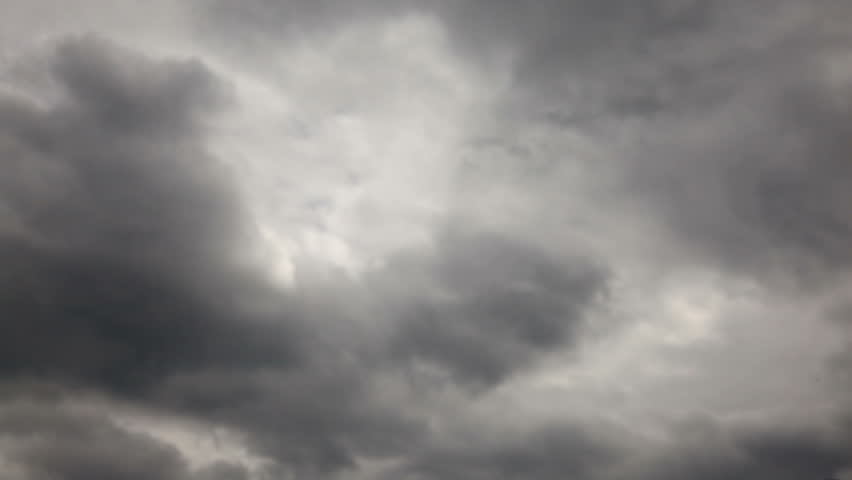 Shadows of Soldiers passing machine gunner on grey sky