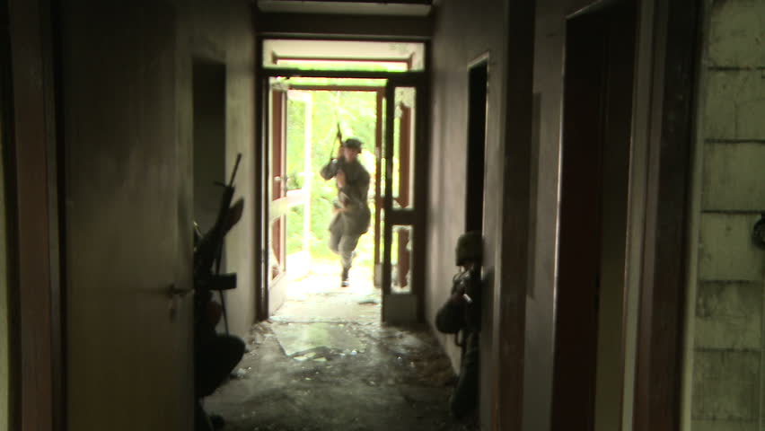 Soldiers entering old building
