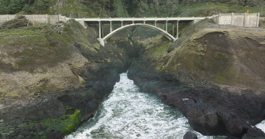 Aerial static view of bridge and blowhole at Captain Cook Point, Cape Cove, Oregon Coast