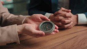 Businessman businesswoman Arabian man Muslim woman in hijab male female business partners hold compass search direction navigation in financial world rotating pointer trade stock market money success - Powered by Shutterstock - Get 15% off with code: PIKWIZARD15