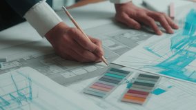 Indian business man designer architect engineer constructor drawing building plan sketch construction blueprint on desk male female team coworkers muslim women discuss architecture project in office - Powered by Shutterstock - Get 15% off with code: PIKWIZARD15