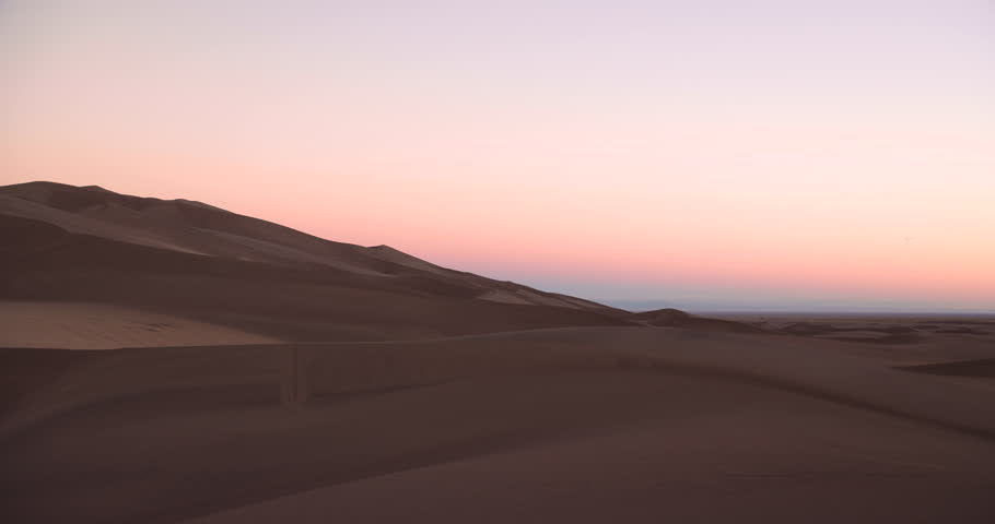 Solo Female traveller in winter exploring Great Sand Dunes National Park Colorado USA travel and tourism